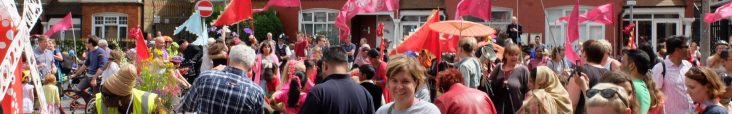 Diverse group of people and flags at the Tour de Tooting